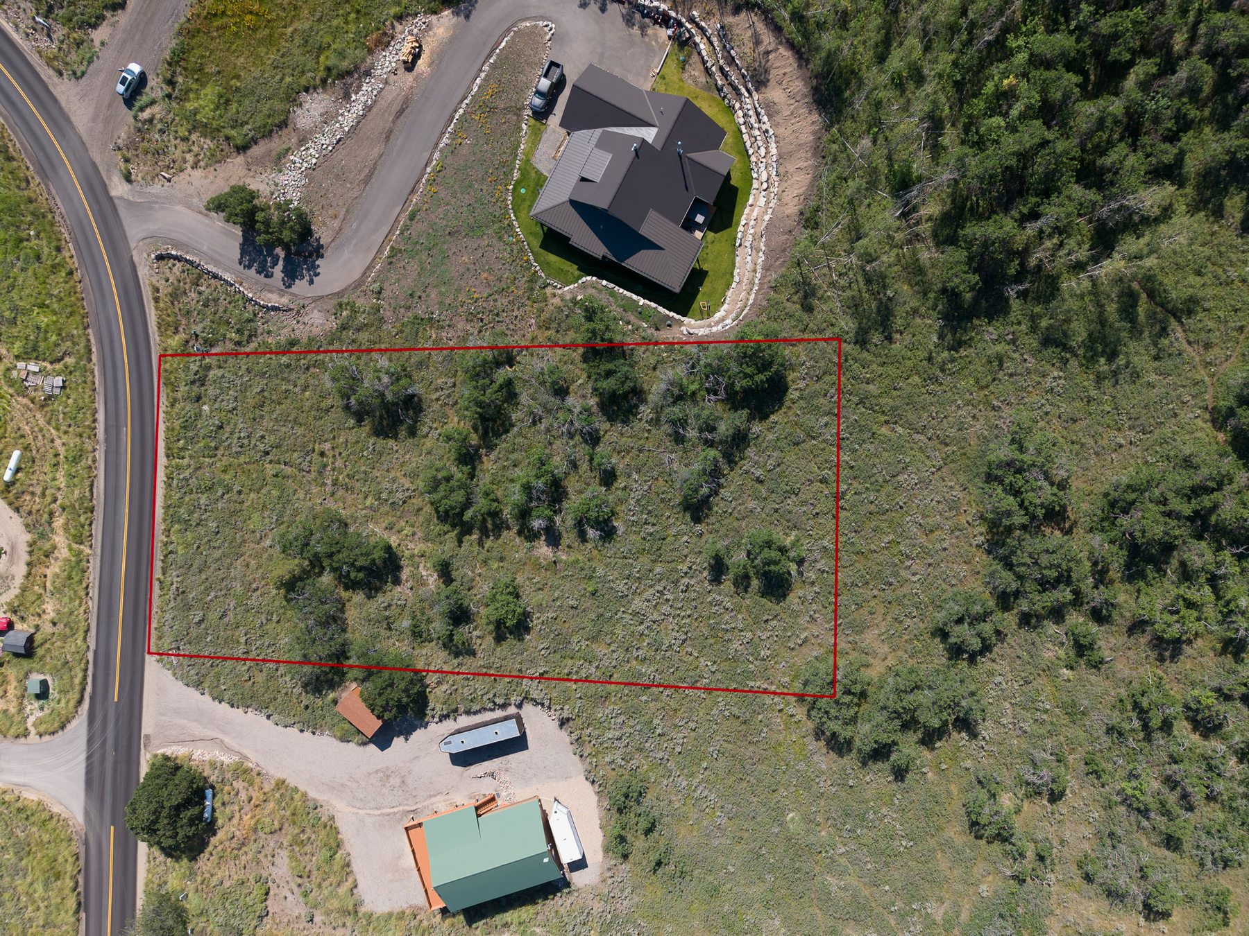 Overhead aerial view of 10220 E Lake Pines Dr lot boundary lines in Timberlakes showing 1 acre parcel size